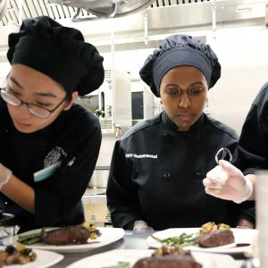 Magnet high school students prepare dishes