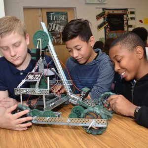 Magnet middle school students work on robotics