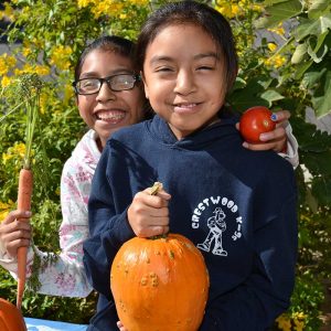 Students show off their garden haul