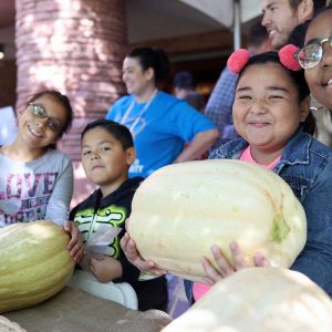 Students show off their garden haul