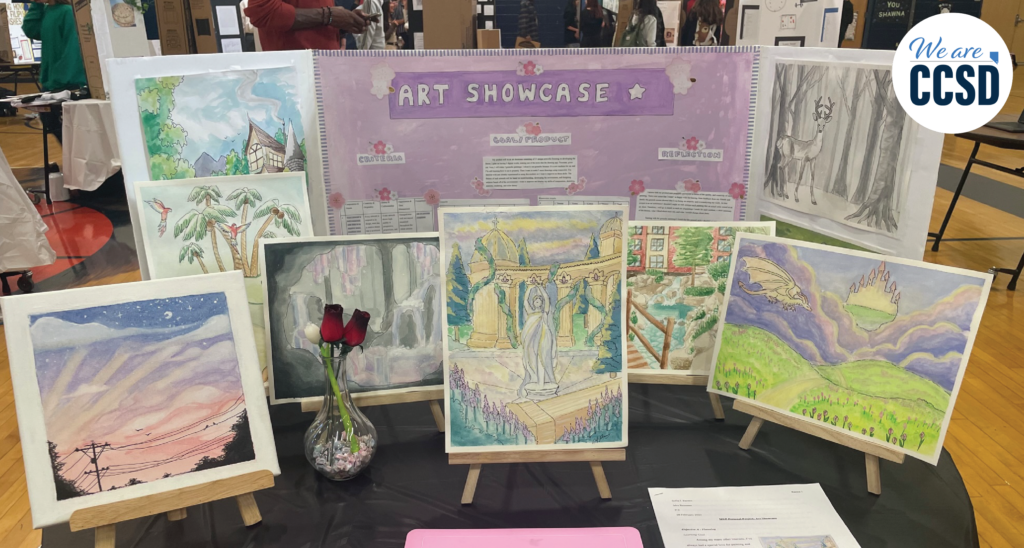 Multiple student drawings displayed for a school art showcase.