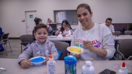 Happy child and adult at family engagement event