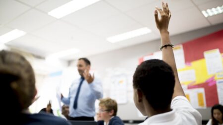 Student with hand raised