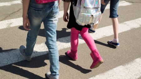 Students walking in a crosswalk