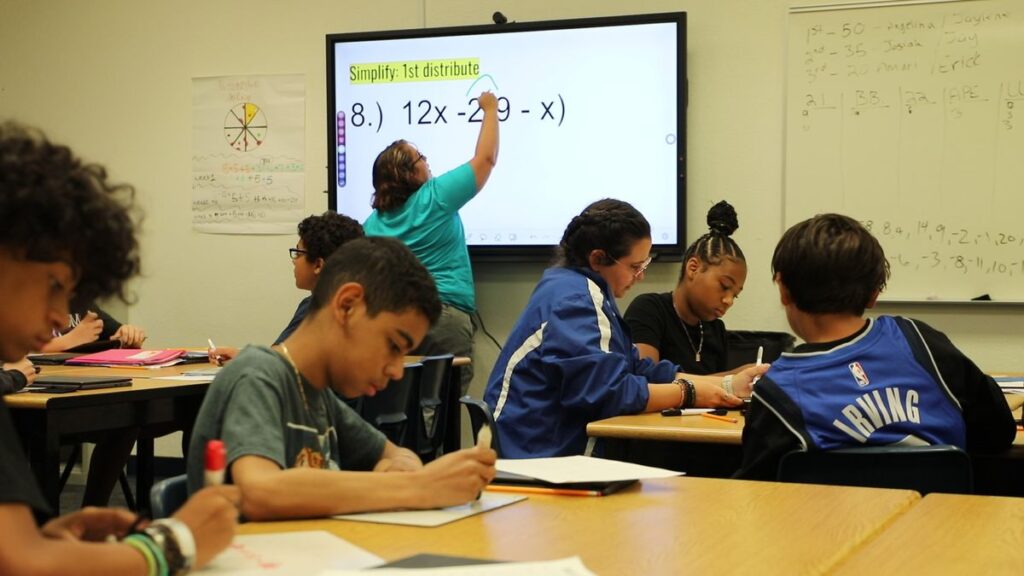 Math classroom with teacher at the smartboard