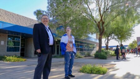 Principal Christopher Hermes outside of Lyal Burkholder Middle School, which is the recipient of a prestigious federal grant to assist the development of magnet schools.