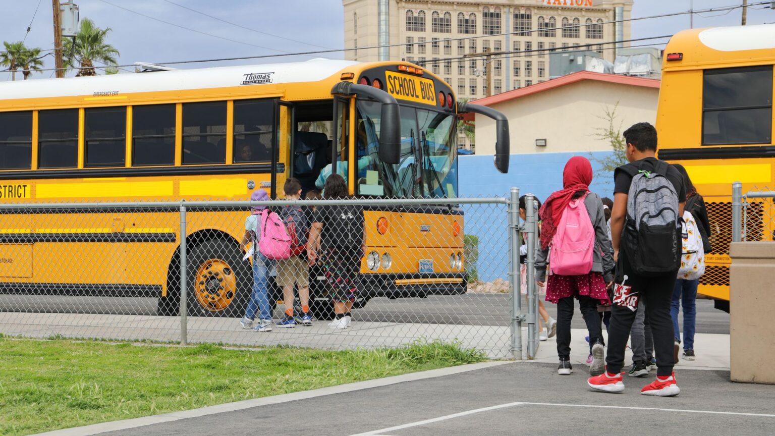 Students load the bus at Rex Bell Elementary School