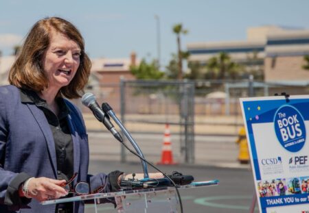 Dr. Brenda Larsen-Mitchell speaks at a Book Bus event in 2024.