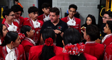 Las Vegas High School Mariachi Director Stephen Blanco speaks with students.