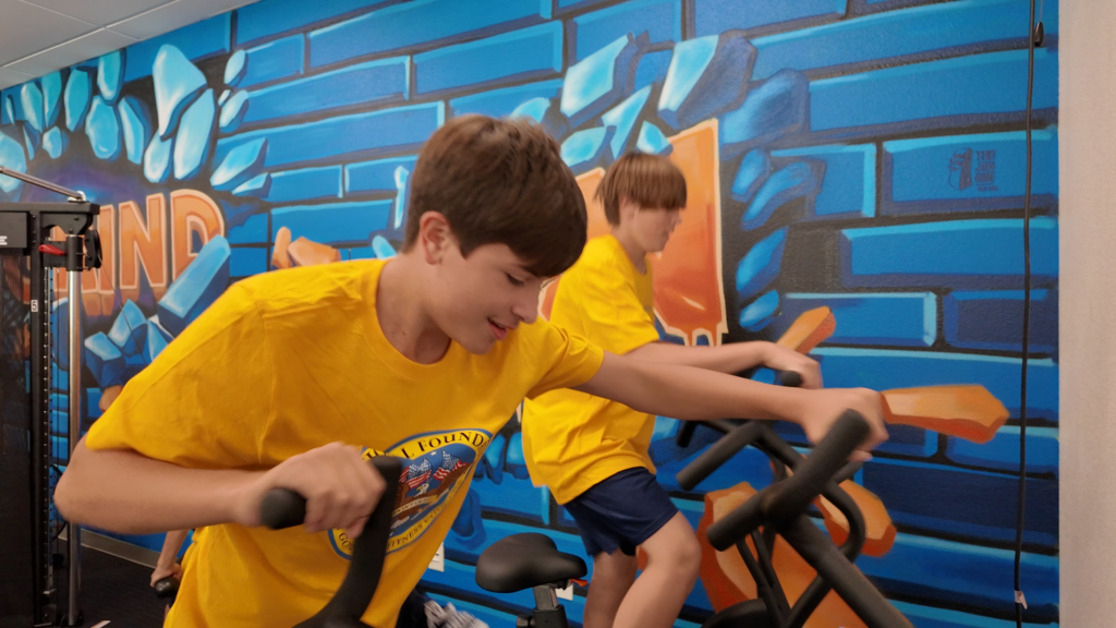 Students from Gunderson Middle School use new equipment from the new state-of-the-art fitness center.