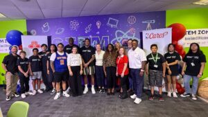 Staff from Heart of America, the NBA, State Farm, and Guinn Academy gather for a photo celebrating a new STEM lab at the school.