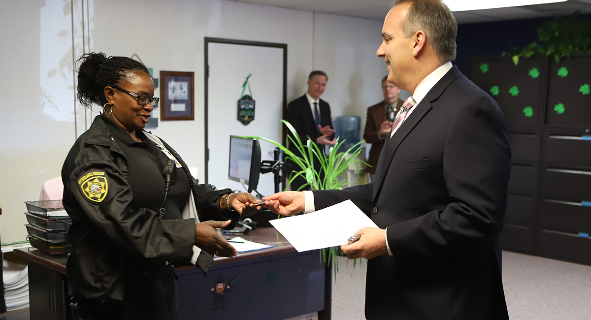 Superintendent Jara distributes challenge coins to exemplary employees